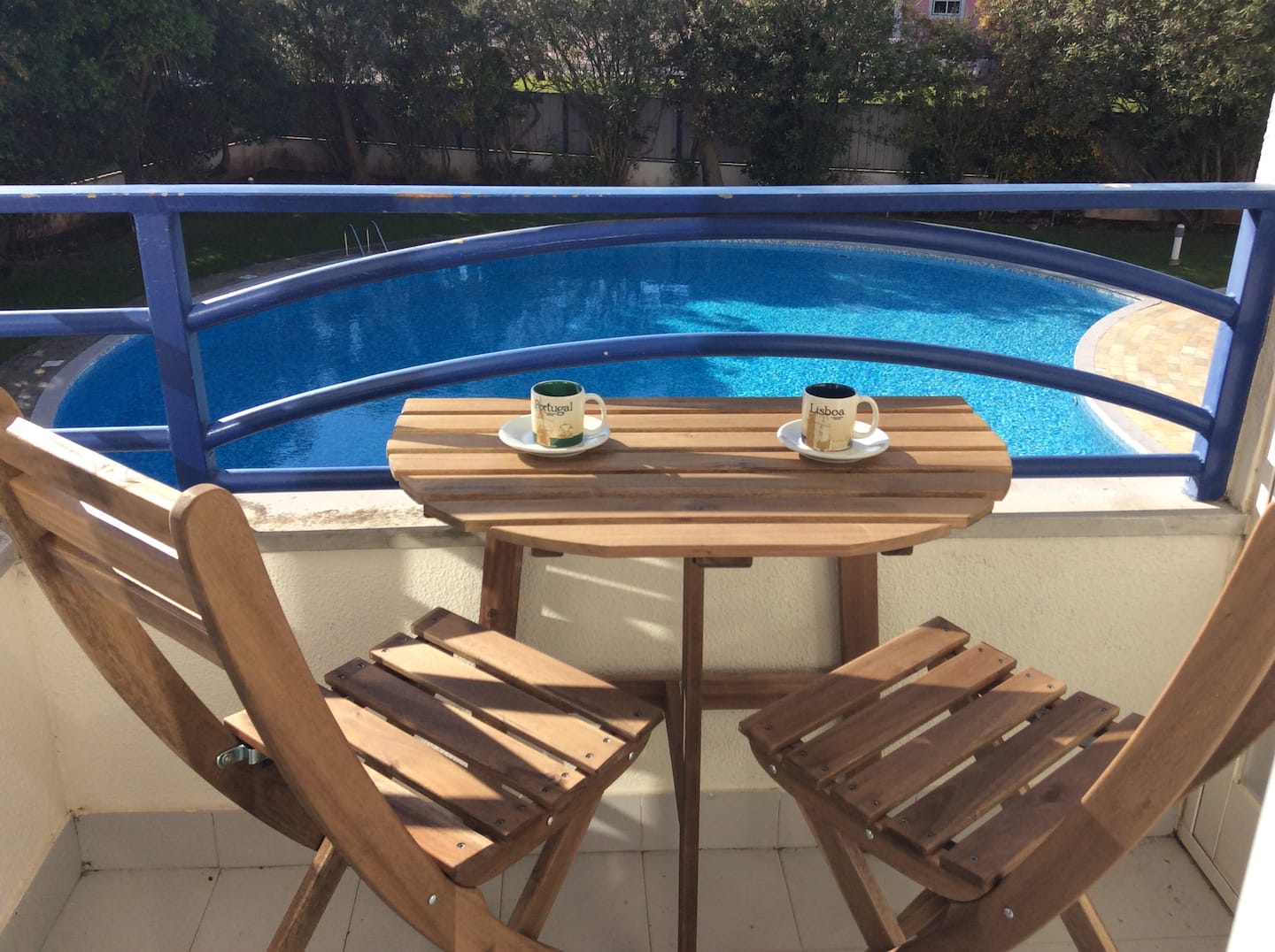 A table for two on the balcony overlooking the pool