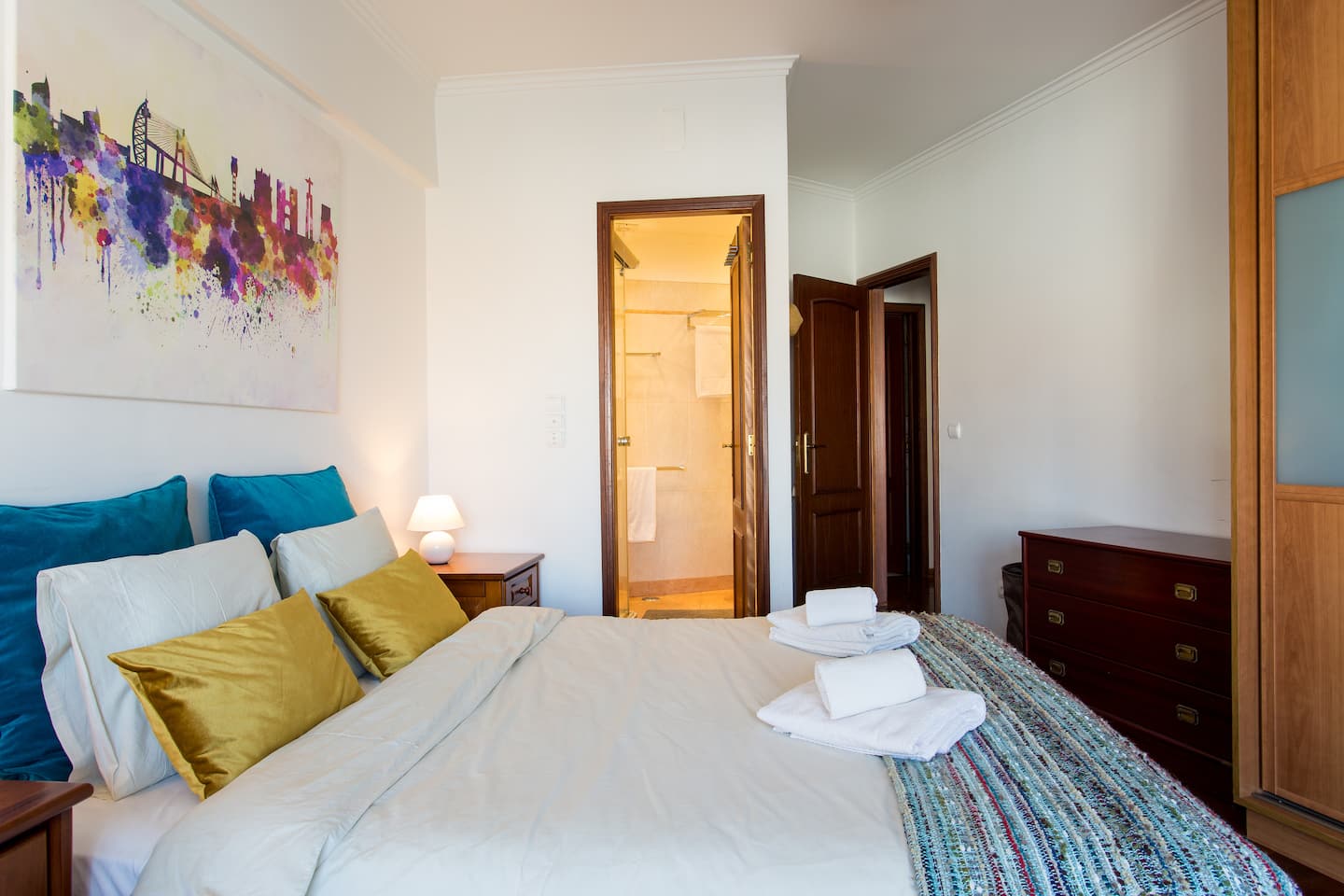 Wide view of the main bedroom and its storage