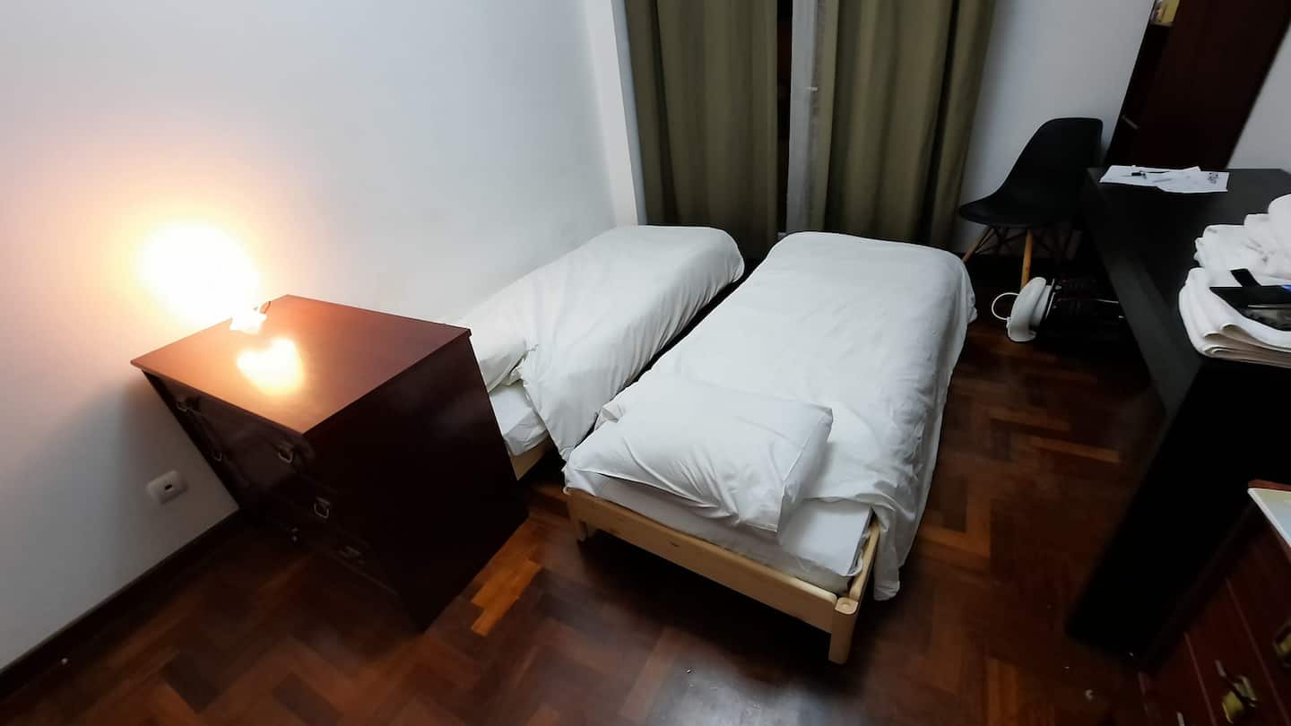 Second bedroom arranged with two single beds