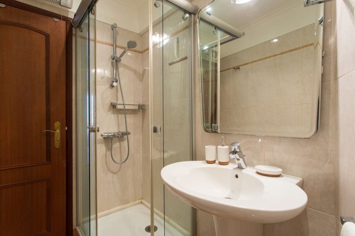 Second bathroom with a glass shower enclosure